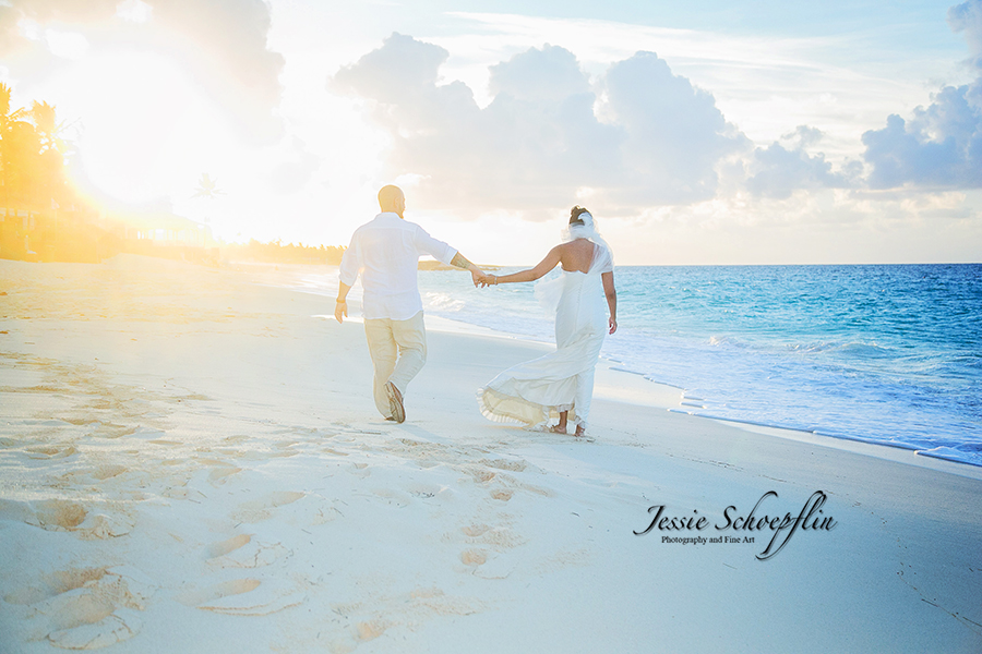 14-bride-and-groom-holding-hands-on-beach