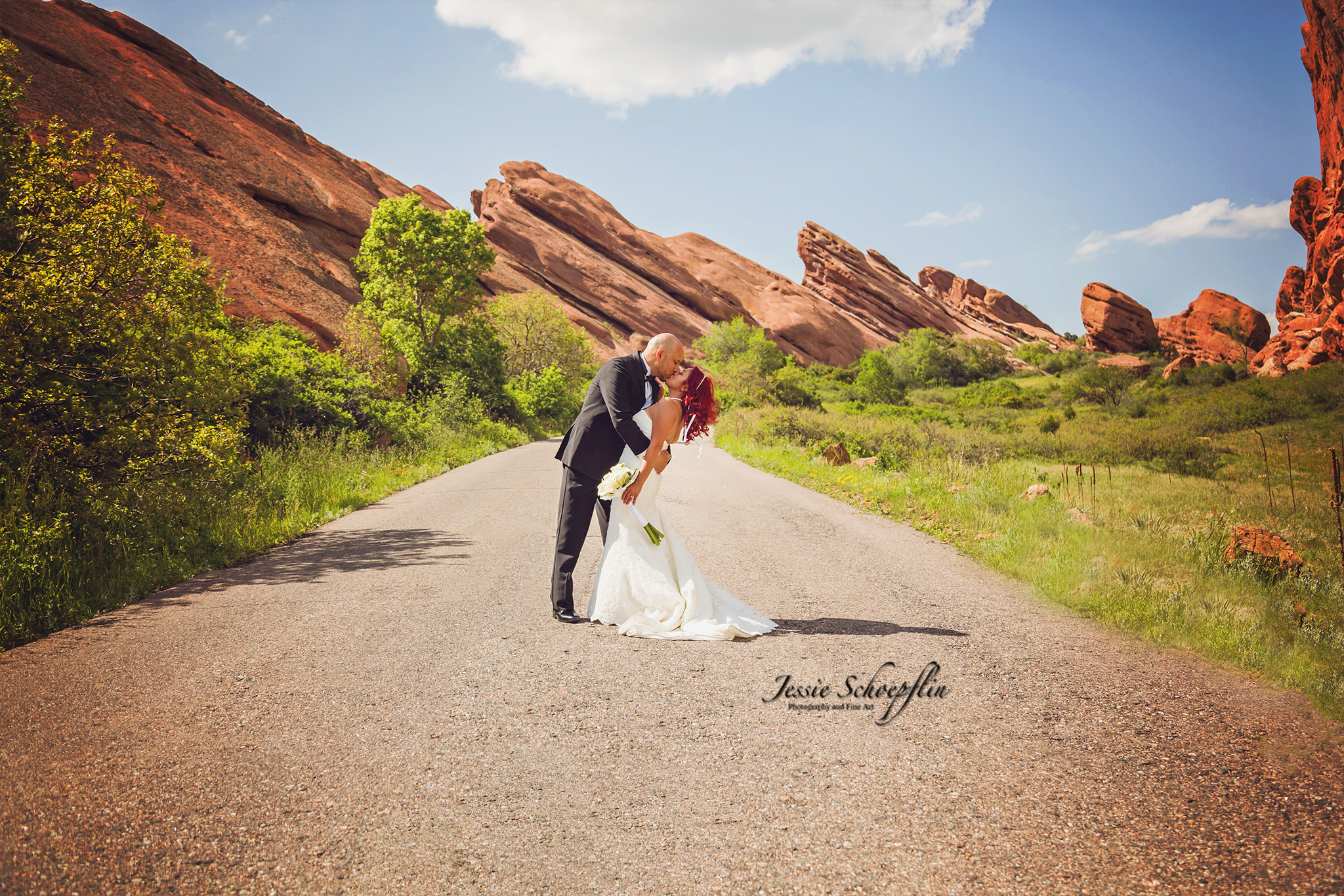 bride-and-groom-dip-red-rocks-ampitheater